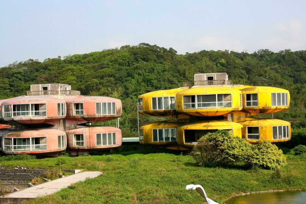Sanzhi UFO Houses – a broken pod reveals an overgrown interior, symbolizing decay of the abandoned resort.