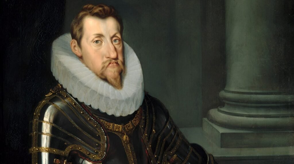 A portrait of King Ferdinand II, with a beard and mustache, wearing armor and a white ruffled collar.