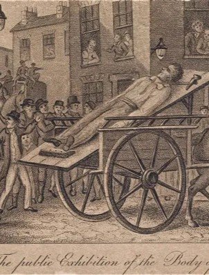 A historical engraving shows a deceased man, "The public exhibition of the body of John Williams," on a cart being pulled through a street lined with onlookers and buildings.