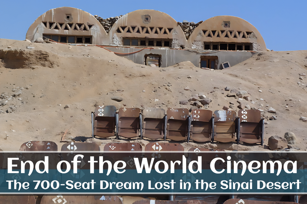 Abandoned cinema seats in front of unique dome-shaped structures, part of the lost desert theater known as the End of the World Cinema.