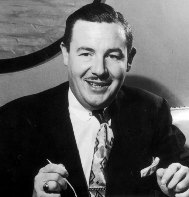 Frank McNamara was having dinner in a 1950s New York restaurant when he realized he’d forgotten his wallet, captured here as he sits at the table looking surprised and uneasy.