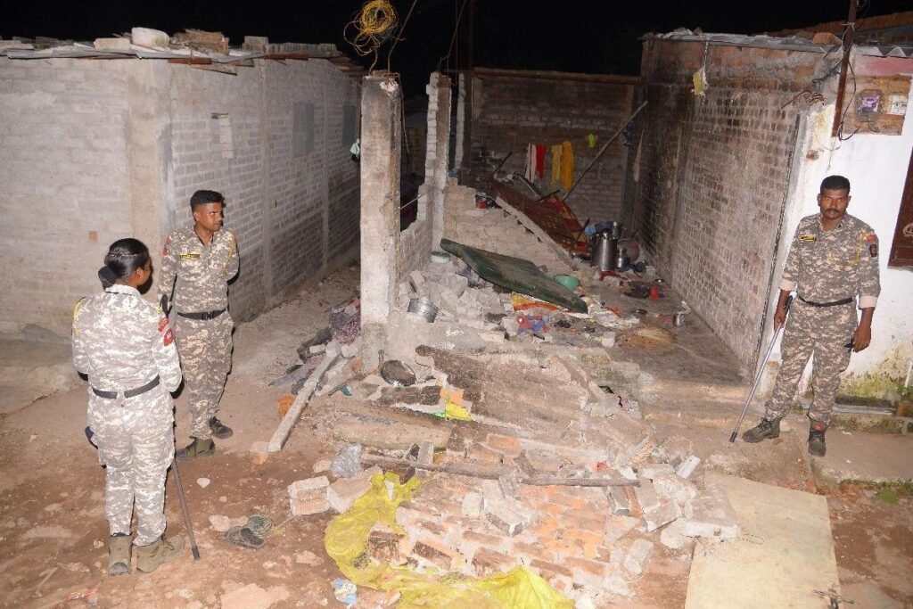Police investigate the ruins of a house in Kasturba Nagar, a scene of violence linked to the person Akku Yadav and his gang's reign of terror.