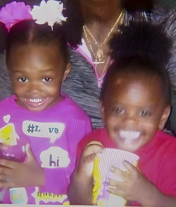 A smiling photo of Nicole Michelle Johnson's two young daughters.