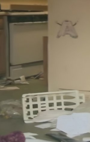 A filthy and debris-strewn room in the Blair household, highlighting the horrific environment the children lived in.